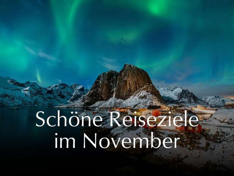 Schöne reiseziele im november steht neben einem schneebedeckten berg