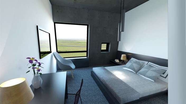 Ein Schlafzimmer mit einem Bett und einem Stuhl