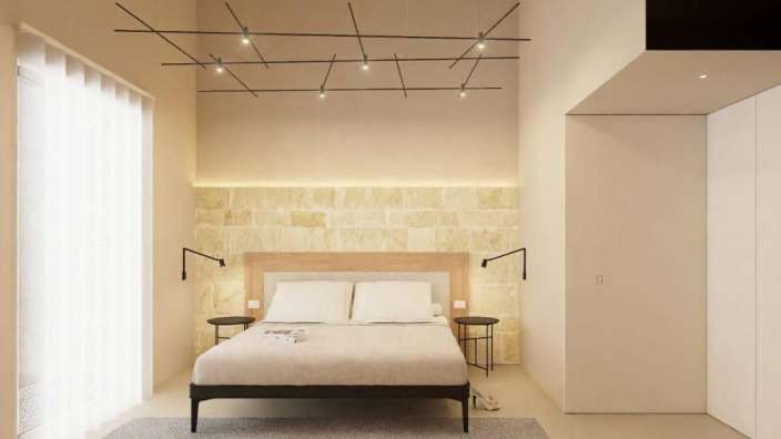 Ein Schlafzimmer mit einem Bett und zwei Nachttischen