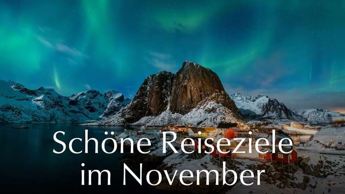 Schöne reiseziele im november steht neben einem schneebedeckten berg