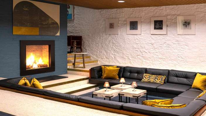 Ein Wohnzimmer mit einer Couch und einem Kamin