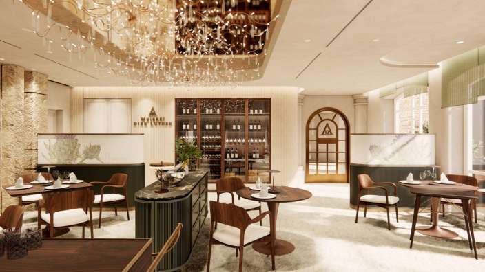 Ein Esszimmer mit Tischen und Stühlen und einem riesigen Kronleuchter